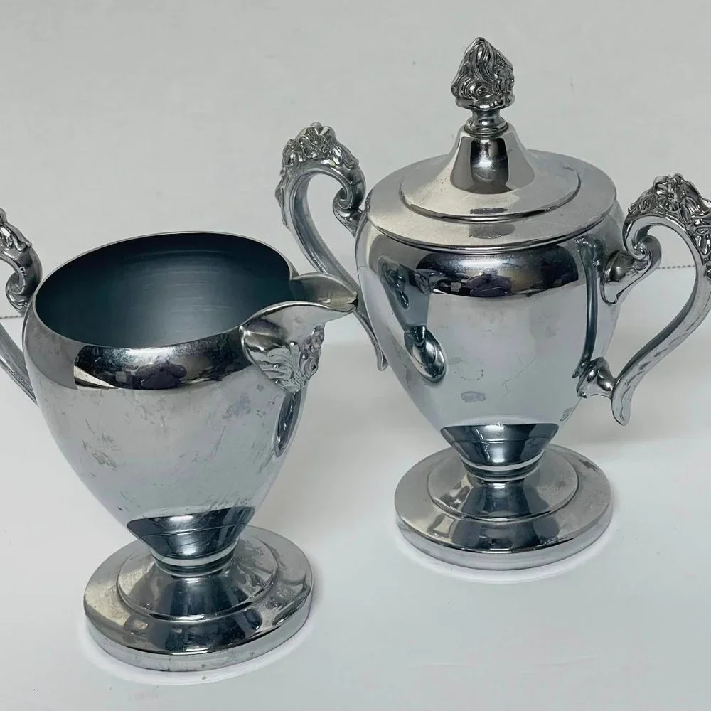 Silverplated ~stainless steel pieces. Tray, Teapot, 2 Sugar Bowls, 2 Creamers ~
